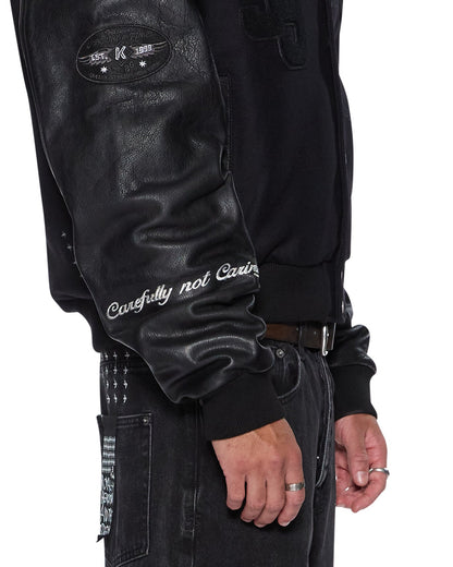 PATCHED VARSITY JACKET BLACK